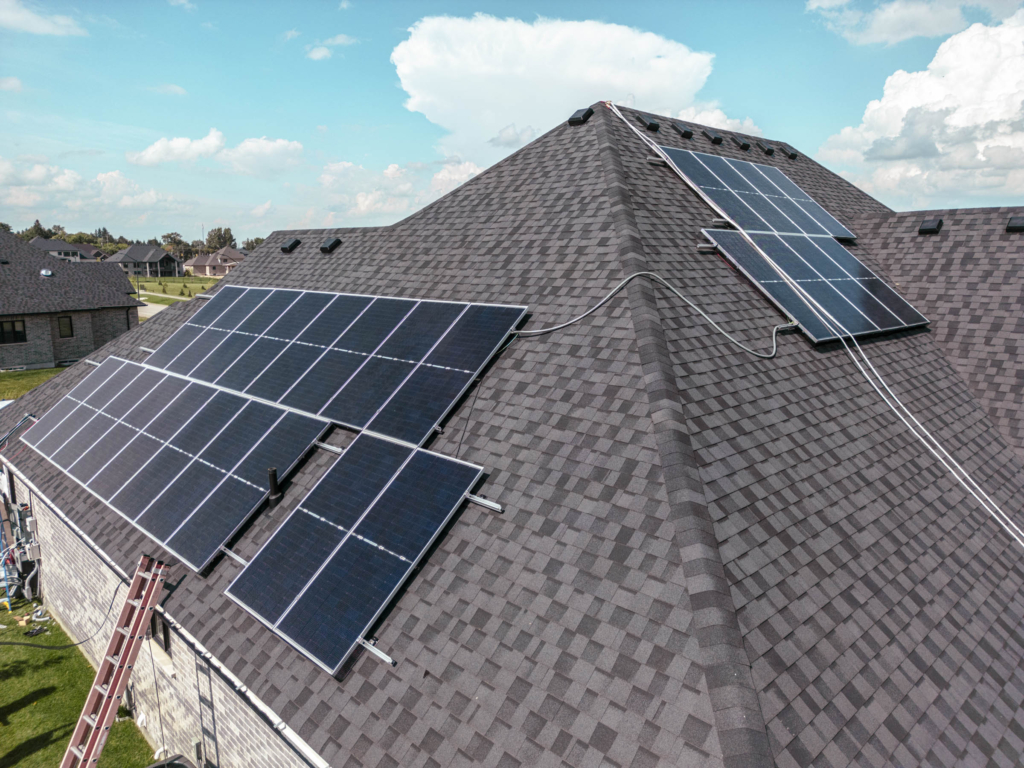 Close-up drone photo of solar panels installed by subcontractor team